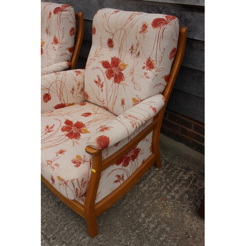 494 - A pair of Ercol showframe armchairs with loose seat and back cushions