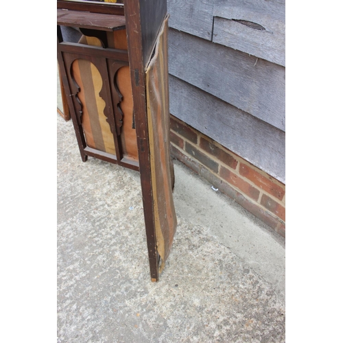 504 - An Edwardian mahogany two-section folding towel rail, 44