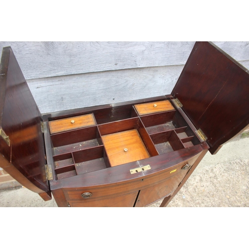 506 - An Edwardian satinwood and banded flap top sewing table, fitted one faux drawer over cupboard, on sq... 