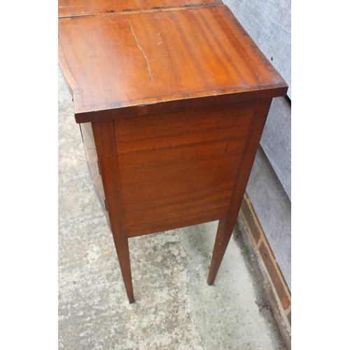 506 - An Edwardian satinwood and banded flap top sewing table, fitted one faux drawer over cupboard, on sq... 