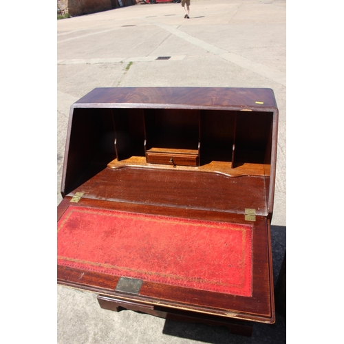 513 - A mahogany fall front bureau, fitted four long graduated drawers, 28