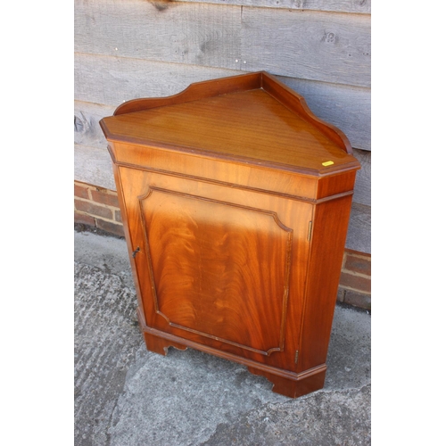 514 - A yew wood break front sideboard, fitted six drawers and two cupboards, 41