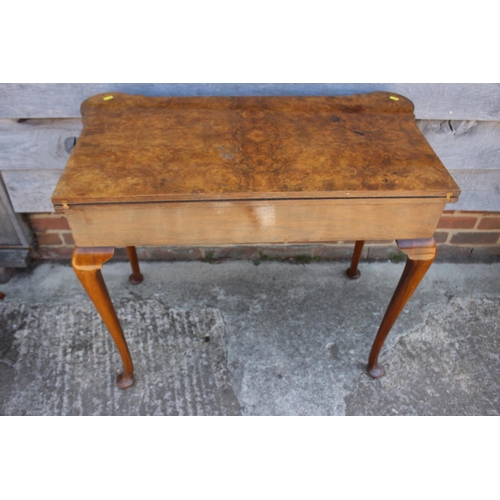 515 - An 18th century style figured walnut fold-over card table with blue baize, on cabriole supports and ... 