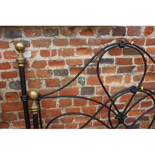 522 - A wrought iron and brass double bed frame, 53