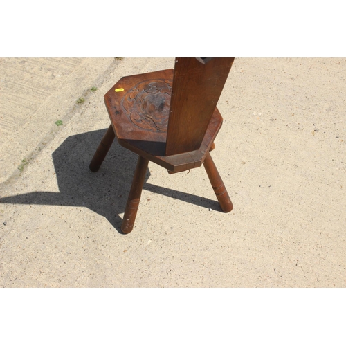 534 - A mahogany octagonal top two-tier occasional table, 26