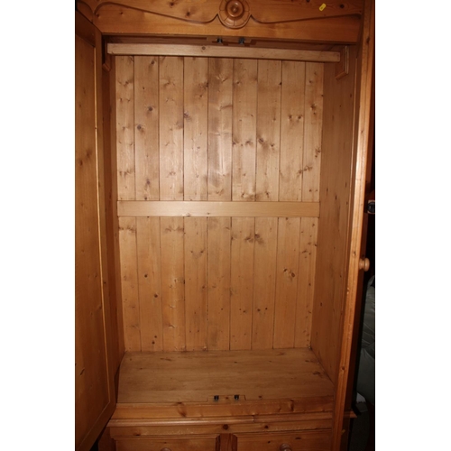 542 - A stripped pine wardrobe, fitted two doors over two drawers, on bracket supports, 45