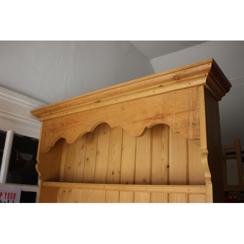 546 - A waxed pine dresser, fitted shelves over four drawers and cupboard, 42