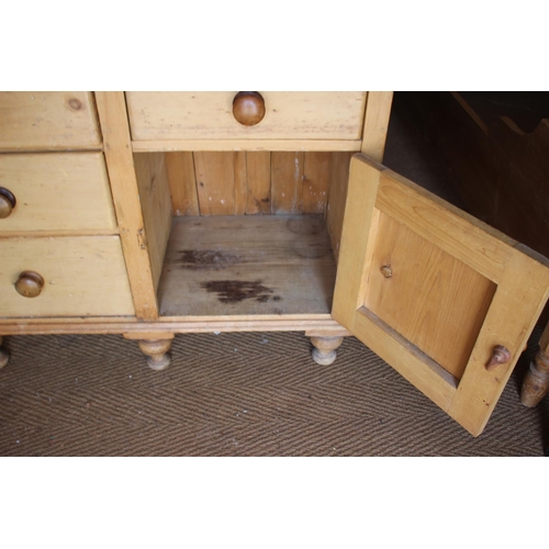 546 - A waxed pine dresser, fitted shelves over four drawers and cupboard, 42