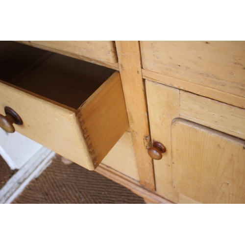 546 - A waxed pine dresser, fitted shelves over four drawers and cupboard, 42