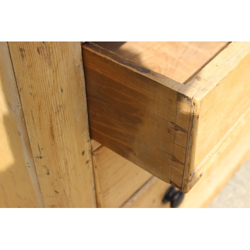 547 - A pine  chest of two short and two long drawers with knob handles, 41