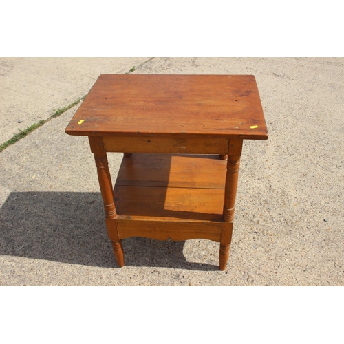 548 - A pine two-tier occasional table, 25