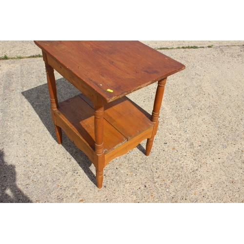 548 - A pine two-tier occasional table, 25