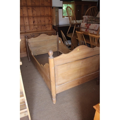 549 - A 19th century stripped pine bed with shaped panel ends, 42