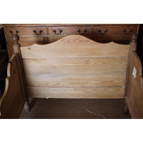 549 - A 19th century stripped pine bed with shaped panel ends, 42