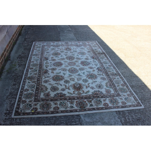 554 - A John Lewis floral decorated rug on a natural ground, 96