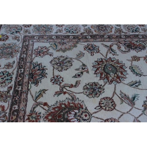 554 - A John Lewis floral decorated rug on a natural ground, 96