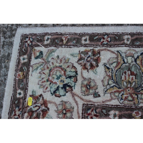 554 - A John Lewis floral decorated rug on a natural ground, 96