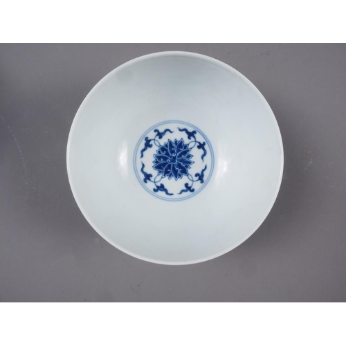 62 - A Chinese blue and white porcelain bowl with lotus flower, scroll and Greek key decoration, six-char... 