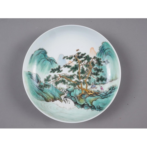 63 - A Chinese famille verte dish, decorated two figures in a landscape, seal mark to base, 8