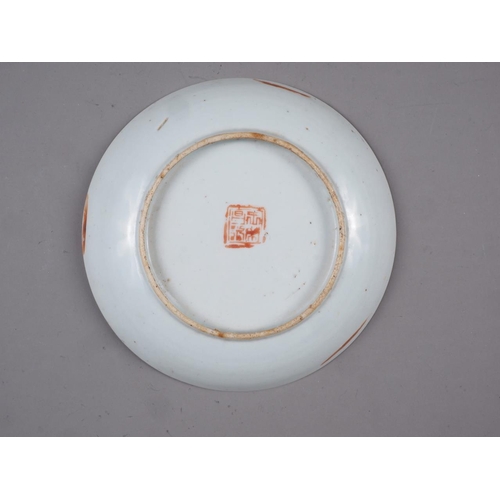 64 - A Chinese dish, decorated with a dragon, flaming pearl and phoenix, on a yellow ground, seal mark to... 