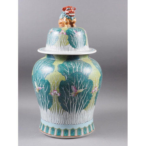 76 - A Chinese famille verte baluster vase and cover, decorated trees, butterflies and flowers, with Dog ... 