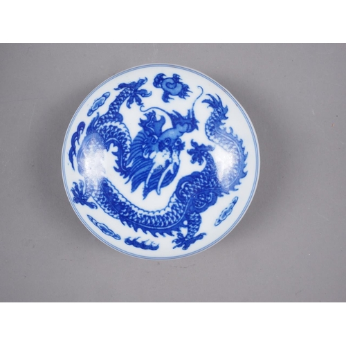 77 - A Chinese famille verte plate, decorated central dragon, flowers and foliage, 8