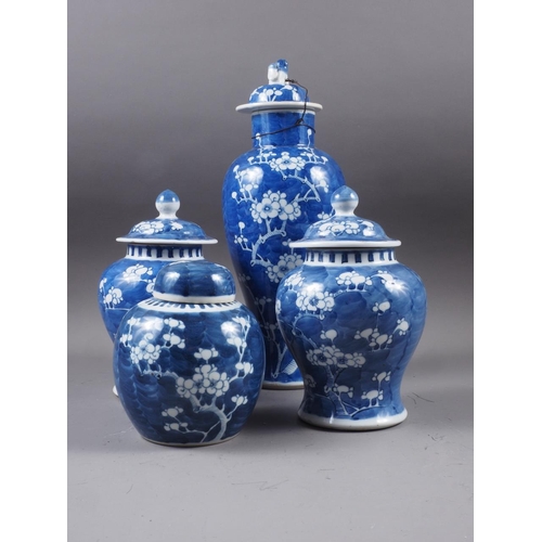 88 - A Chinese blue and white baluster vase and cover, decorated prunus, double ring mark to base, 14