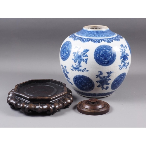 95 - A Chinese blue and white bulbous vase, decorated circular panels, flowers and fruit, 10 1/4