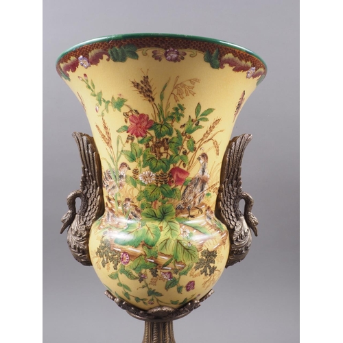 96 - A Chinese urn with gilt mounts and handles, formed as birds, and bird, foliage and flower decoration... 