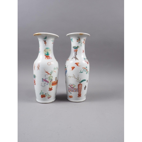 97 - A pair of 19th century Chinese baluster vases, decorated precious objects, 10