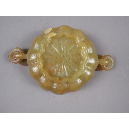 99 - A Chinese jade lotus dish with ring handles, 5 3/4