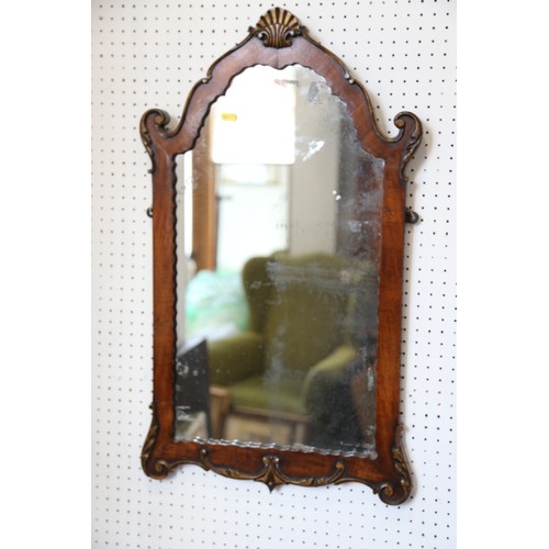 451 - A 19th century walnut and gilded shape top wall mirror, 30