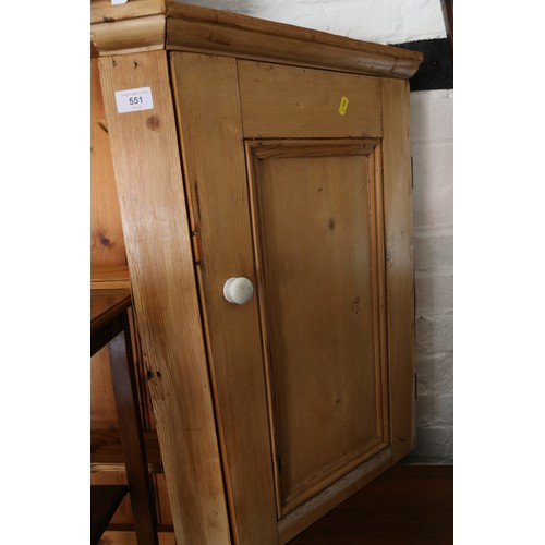 551 - A waxed pine corner cupboard enclosed one door, 21