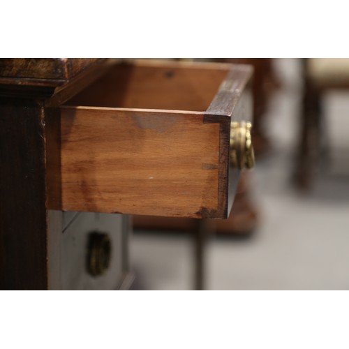 526 - An early 20th century mahogany writing desk, fitted tool lined top over five drawers, on square tape... 