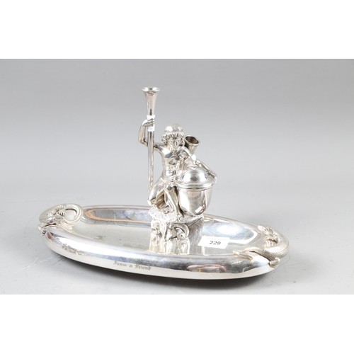 229 - A silver plated desk ink stand, formed as a classical figure and two lizards, 12 3/4