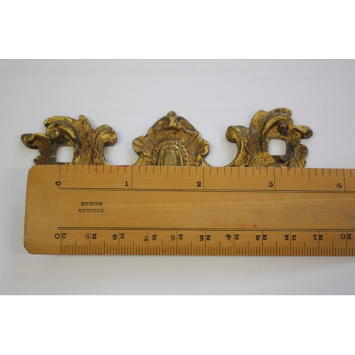 128 - A set of eight mid 18th century ormolu rococo scrollwork handles and back plates with pillars, 2.1