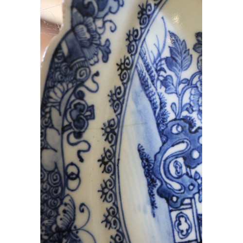 71 - A Chinese blue and white brush pot decorated precious objects, a pair of blue and white willow patte... 