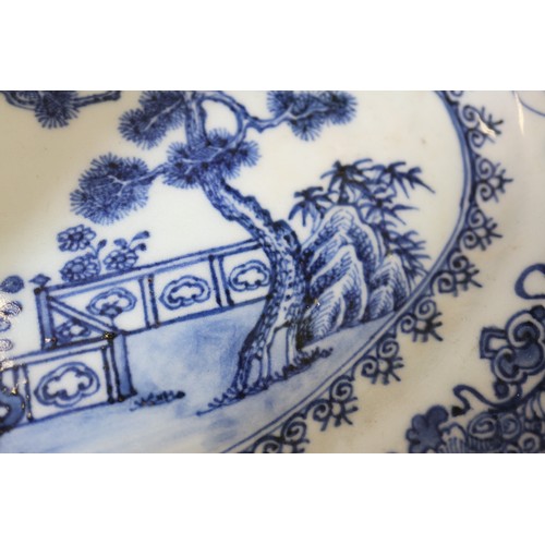 71 - A Chinese blue and white brush pot decorated precious objects, a pair of blue and white willow patte... 