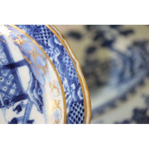 71 - A Chinese blue and white brush pot decorated precious objects, a pair of blue and white willow patte... 