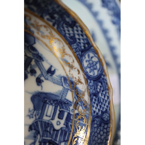 71 - A Chinese blue and white brush pot decorated precious objects, a pair of blue and white willow patte... 