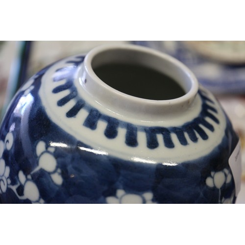 88 - A Chinese blue and white baluster vase and cover, decorated prunus, double ring mark to base, 14