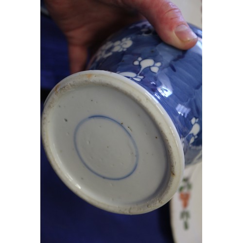 88 - A Chinese blue and white baluster vase and cover, decorated prunus, double ring mark to base, 14