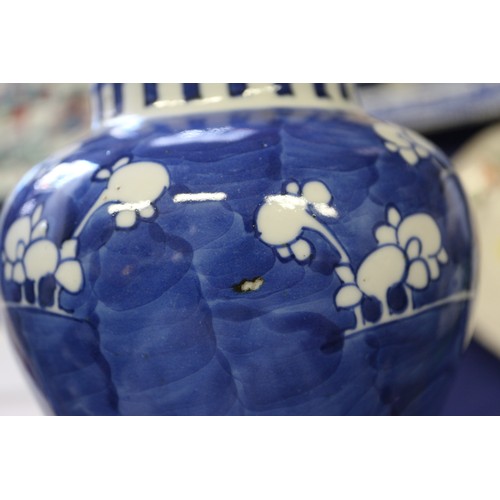 88 - A Chinese blue and white baluster vase and cover, decorated prunus, double ring mark to base, 14