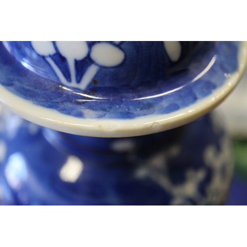 88 - A Chinese blue and white baluster vase and cover, decorated prunus, double ring mark to base, 14