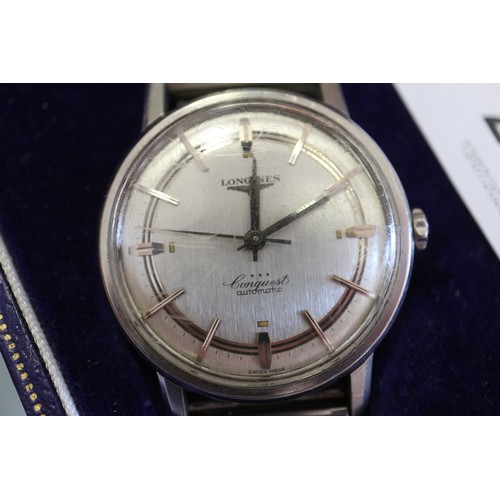 267 - A gentleman's Longines Conquest stainless steel automatic wristwatch with silvered dial and baton nu... 