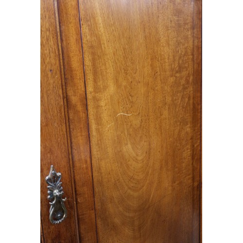 430 - A 19th century French walnut inverse breakfront wardrobe enclosed four panel doors, on turned suppor... 