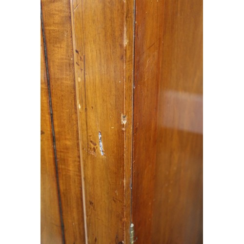 430 - A 19th century French walnut inverse breakfront wardrobe enclosed four panel doors, on turned suppor... 