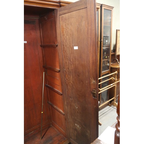 430 - A 19th century French walnut inverse breakfront wardrobe enclosed four panel doors, on turned suppor... 