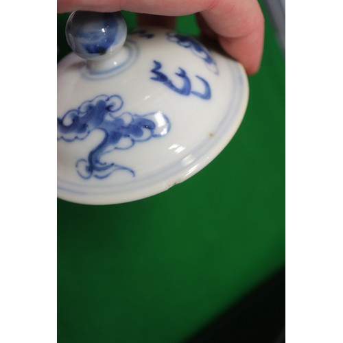 83 - A Chinese blue and white ovoid teapot with associated lid, dragon and cloud decoration, four-charact... 