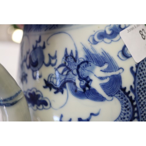 83 - A Chinese blue and white ovoid teapot with associated lid, dragon and cloud decoration, four-charact... 